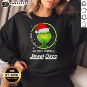 Premium Grinch Christmas sweatshirt featuring 'I Used to Smile and Then I Worked at Jewel Osco' humorous design.