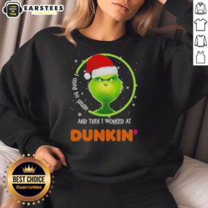 Premium Grinch sweatshirt featuring 'I Used to Smile and Then I Worked at Dunkin Donuts' design, perfect for holiday wear.