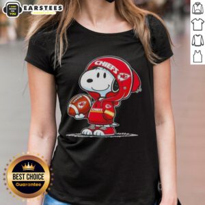 Cute Snoopy in a Kansas City Chiefs hoodie smiles at fans on a ladies tee, perfect for Chiefs supporters.