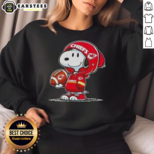 Snoopy in a Kansas City Chiefs hoodie smiling at fans, showcasing a cute Peanuts sweatshirt design.