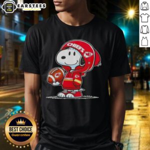 Alt Text: Cute Peanuts Snoopy in a Kansas City Chiefs hoodie, smiling at fans on a fun T-shirt design.