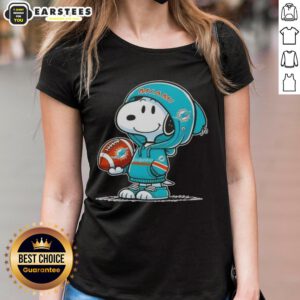 Cute Peanuts Snoopy wearing a Miami Dolphins hoodie, smiling at fans on a ladies tee design.