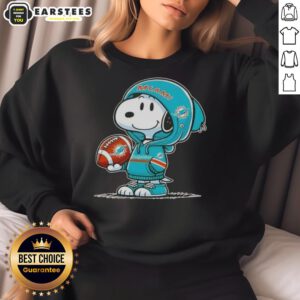 Cute Peanuts Snoopy wearing Miami Dolphins hoodie, smiling at fans in a colorful sweatshirt.