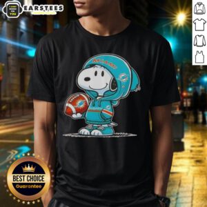 Alt Text: Cute Peanuts Snoopy in a Miami Dolphins hoodie, smiling at fans on a fun graphic T-shirt design.