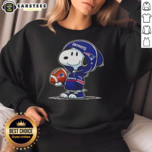 Alt Text: Cute Peanuts Snoopy in a New England Patriots hoodie, smiling at fans while wearing a cozy sweatshirt.