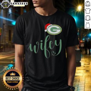 Alt Text: Happy Wifey wearing a Green Bay Packers Santa hat and Merry Christmas T-shirt, celebrating the holiday season.