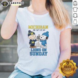 Alt Text: Premium Charlie Brown Michigan Wolverines tee for ladies, featuring Snoopy and Detroit Lions design for weekend wear.