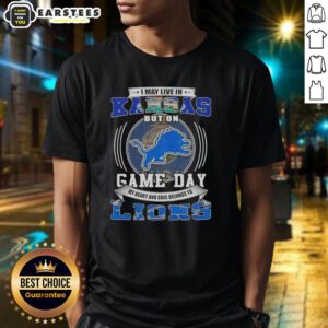 Alt Text: Pretty I May Live In Kansas But On Game Day Detroit Lions Football T-Shirt design featuring team colors and logo.