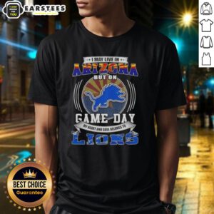 Alt Text: Detroit Lions football T-shirt: 'I May Live In Arizona But On Game Day' design, perfect for loyal fans.