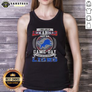 Alt Text: Stylish tank top reading 'I May Live In Arkansas But On Game Day Detroit Lions Football' perfect for game day.