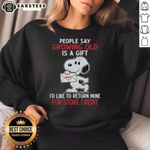 Alt Text: Snoopy sweatshirt featuring the phrase 'Growing old is a gift, I'd like to return mine for store credit.'