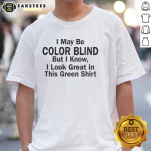 Person wearing a green t-shirt with a humorous quote about color blindness, showing confidence in their green outfit.