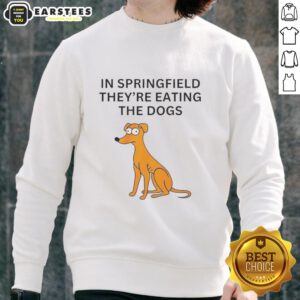 Funny Springfield sweatshirt featuring the phrase 'They're Eating the Dogs' in vibrant colors, perfect for casual wear.