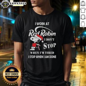 Alt Text: Funny Snoopy Christmas T-Shirt featuring I Work At Red Robin, I Dont Stop When Im Tired slogan.