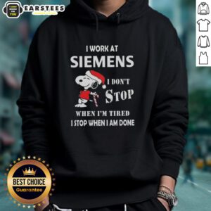 Funny Snoopy Christmas hoodie featuring 'I work at Siemens, I dont stop when Im tired, I stop when I am done' quote.