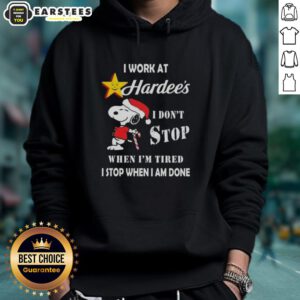 Funny Snoopy Christmas hoodie with 'I work at Hardee's, I don't stop when I'm tired, I stop when I'm done' slogan.