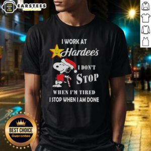 Alt Text: Funny Snoopy Christmas T-shirt featuring I Work At The Hardee's I Don't Stop When I'm Tired slogan.