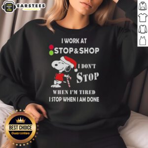 Funny Snoopy Christmas sweatshirt with 'I don't stop when I'm tired, I stop when I'm done' text, perfect for holiday shopping.