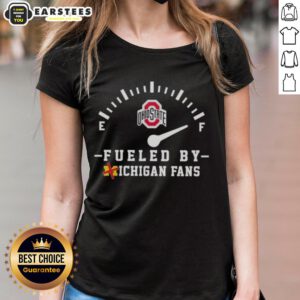 Happy Ohio State Buckeyes fans in a ladies tee, celebrating with excitement and spirit at a Michigan rivalry game.
