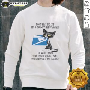 Grumpy USPS woman wearing a 'Nice Tired Cat' sweatshirt, showcasing a humorous take on postal service frustrations.