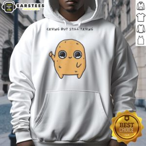 Cute cartoon mascot in a hoodie, looking pretty sad and crying but trying to stay positive, perfect for emotional themes.