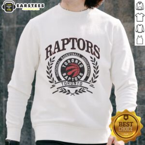 Alt Text: Retro sweatshirt featuring the Toronto Raptors NBA logo framed by a laurel wreath, perfect for basketball fans.