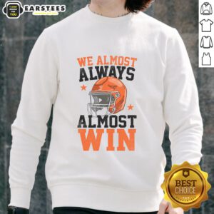 Funny football fan sweatshirt saying 'Pretty We Almost Always Almost Win' perfect for game day cheer.