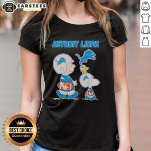 Alt Text: Awesome Detroit Lions X Snoopy and Charlie Brown ladies tee featuring vibrant graphics and team colors.