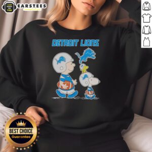 Alt Text: Awesome Detroit Lions X Snoopy and Charlie Brown sweatshirt featuring vibrant graphics and team colors.