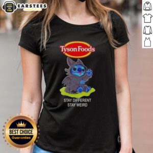 Cute Stitch cosplay wearing a Toothless-themed tee from Tyson Foods, promoting 'Stay Different, Stay Weird' message.