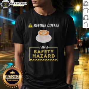 Funny coffee addict T-shirt: 'Good Before Coffee I Am A Safety Hazard' design, perfect for coffee lovers and humor enthusiasts.