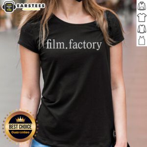 Gael Garcia Bernal wearing a Film Factory ladies tee, showcasing stylish casual fashion in a vibrant setting.
