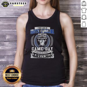 Woman wearing a tank top that reads 'Good I May Live In South Carolina But On Game Day My Heart Belongs To Raiders'.