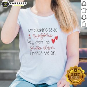 Funny women's tee featuring 'Good My Cooking Is So Qwesothe Even The Smoke Alarm Cheers Me On' design for cooking enthusiasts.