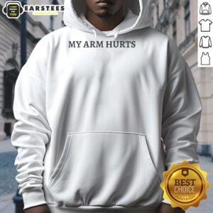 Jimmy Herget wearing a 'My Arm Hurts' hoodie, showcasing casual style and humor in sports apparel.