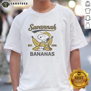Alt Text: Snoopy lying on a banana wearing a Savannah Bananas outfit, showcasing the Est 2016 T-shirt design.