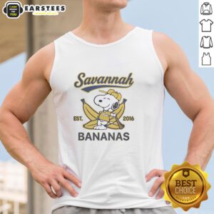 Alt Text: Snoopy lying on a banana, wearing a Savannah Bananas outfit, with 'Est. 2016' tank top, showcasing a fun summer vibe.