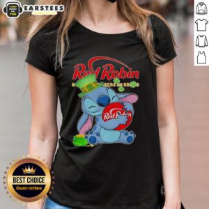Cute Stitch hugging the Red Robin logo on a Happy St. Patrick's Day ladies tee, perfect for festive celebrations.