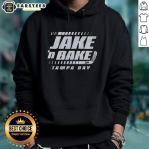 Good Jake Guentzel wearing a stylish 'Jake N Bake' hoodie at a Tampa Bay Lightning hockey game.