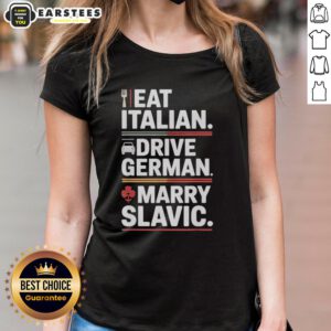 Women in a car wearing 'Awesome Eat Italian Drive German Marry Slavic Balkan Wife' tees, celebrating European culture.