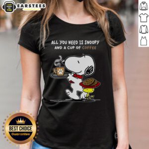 Adorable ladies' tee featuring Snoopy and coffee, perfect for casual wear and dog lovers. Cute and comfy design.