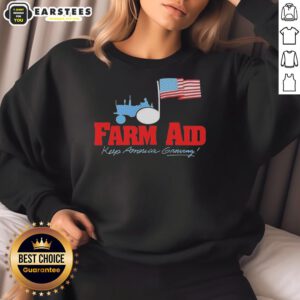 Original Farm Aid Keep America Growing sweatshirt featuring a tractor logo and American flag design.