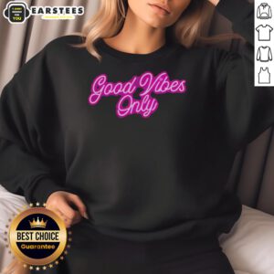 Purple neon sweatshirt with 'Good Vibes Only' text, perfect for a trendy and positive casual look.