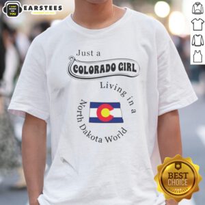 Awesome Just A Colorado Girl Living In A North Dakota World shirt displayed on a wooden background