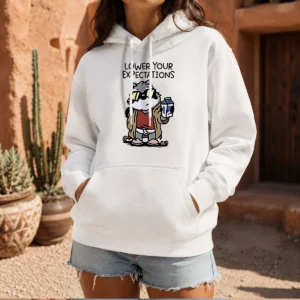 Official Lower Your Expectations Raccoon Cartoon Hoodie in charcoal gray with front pocket and drawstring hood