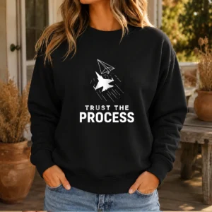 Original Trust The Process Sweater in dark gray with white text, crewneck style, displayed on a flat lay background