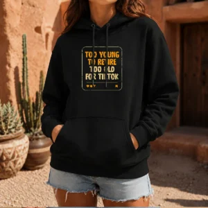 Top Too Old For Tiktok Hoodie in black with front pocket and adjustable hood